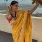 Meenakshi Chaudhary in Pushpanjali Yellow Banarasi Handwoven Silk Saree